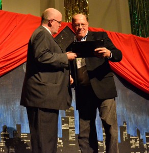 Liam Mitchell accepting the 2012 Sue Nims Award from Dawson Moore